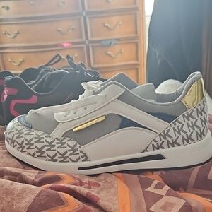 Stylish White and Blue Sneakers with Gold Accent MK